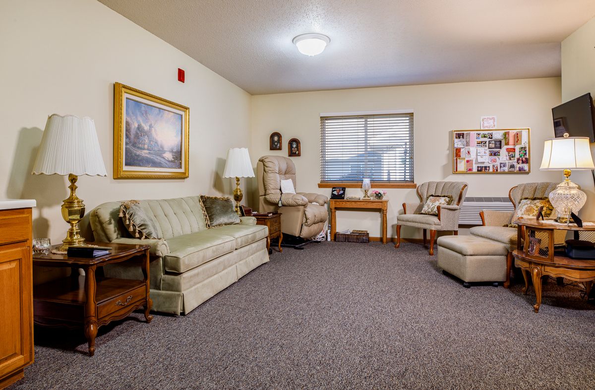 A cozy living room with vintage furniture and soft lighting.