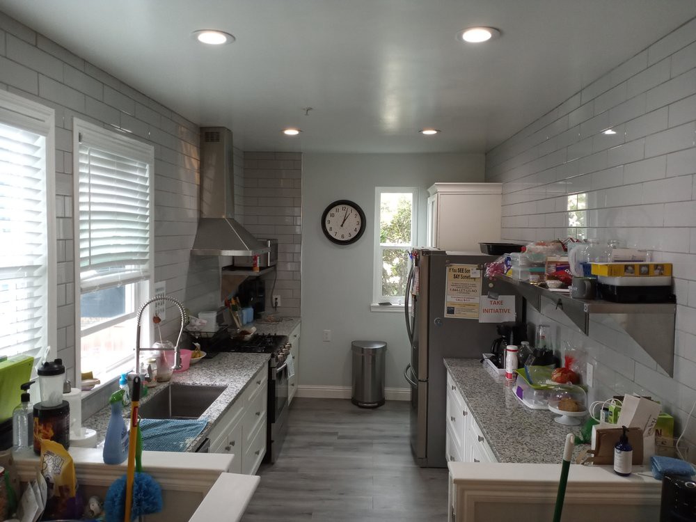 A modern kitchen with stainless steel appliances and a tidy countertop.