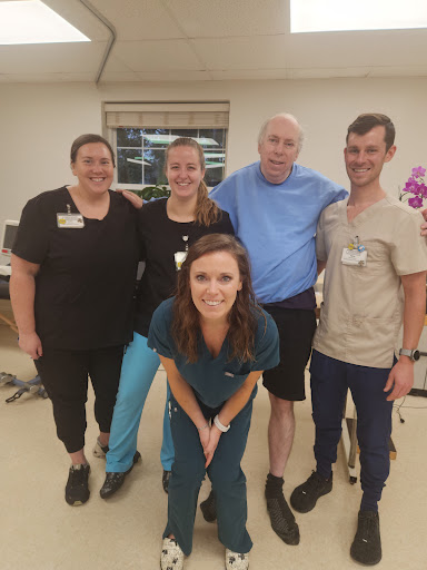 A dedicated healthcare team posing for a group photo.