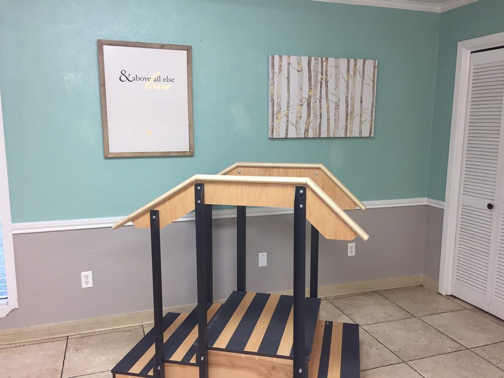 A physical therapy clinic featuring a set of stairs for rehabilitation exercises.