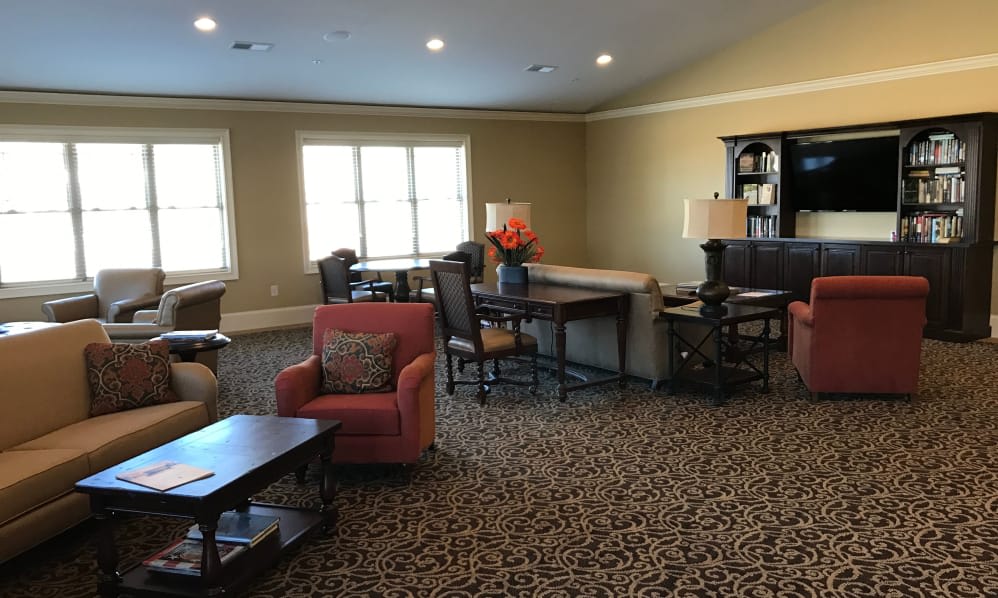 A cozy living room with comfortable seating and a warm atmosphere.