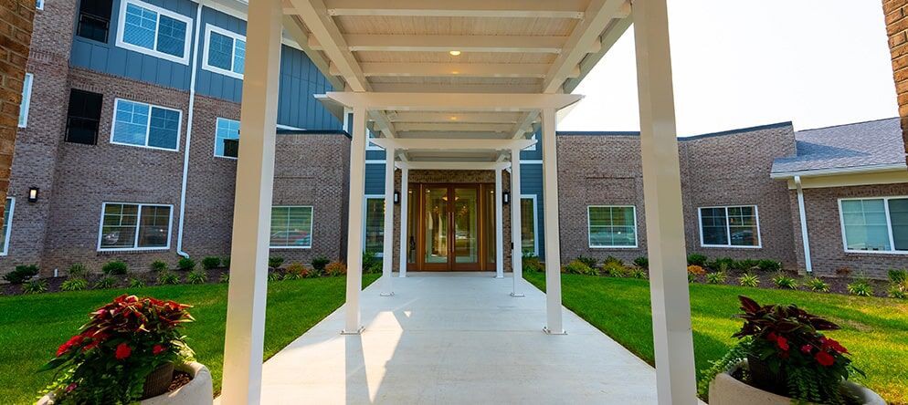 Modern building entrance with a covered walkway.