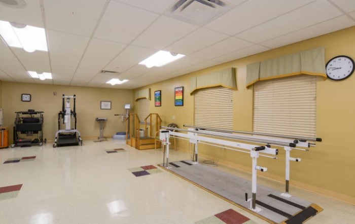 A rehabilitation room equipped with physical therapy equipment.
