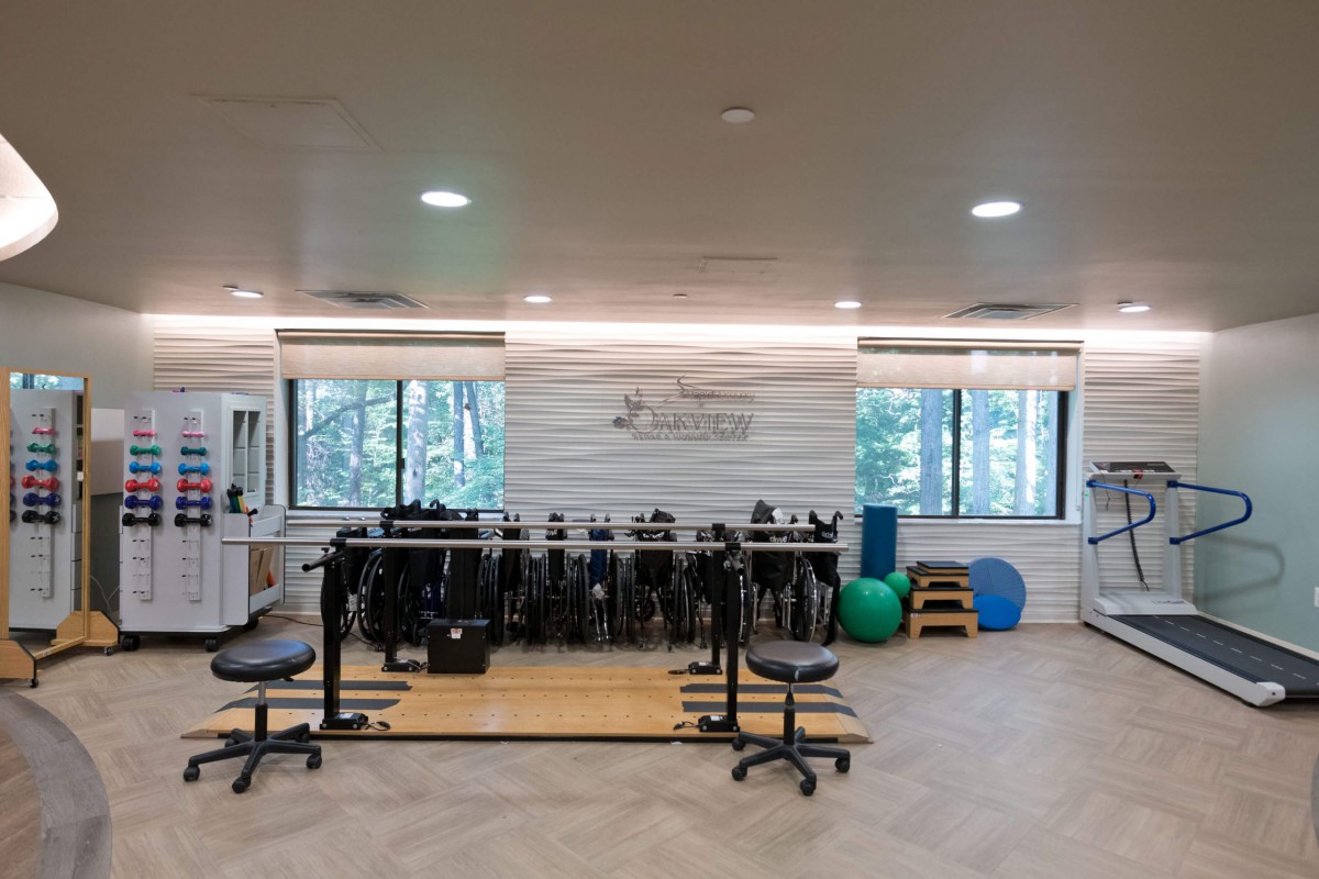 A well-equipped fitness and rehabilitation center with exercise equipment and therapy tools.