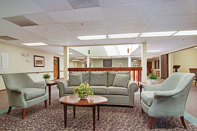 A cozy lobby area featuring a sofa set and coffee table.