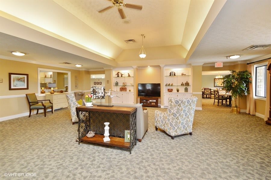 A spacious and cozy living room with elegant decor and comfortable seating.