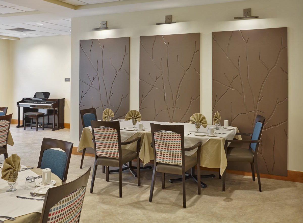 An elegant restaurant dining area with neatly arranged tables and chairs.