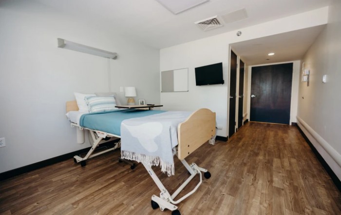 A modern and clean hospital room with a medical bed.