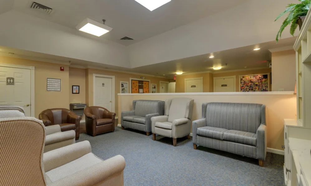 A spacious waiting room with comfortable seating and neutral tones.