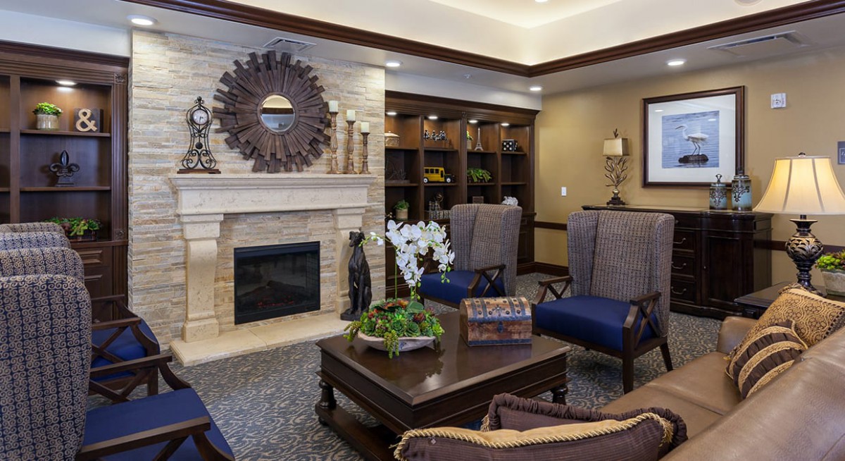 A modern living room featuring a cozy fireplace, stylish furniture, and elegant decor.