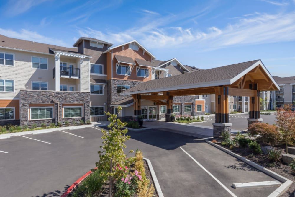 The exterior of a modern hotel with a welcoming entrance and well-maintained landscaping.