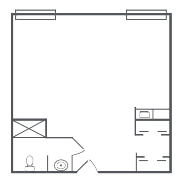 A simple architectural floor plan featuring a room with two windows, a bathroom, and a storage area.