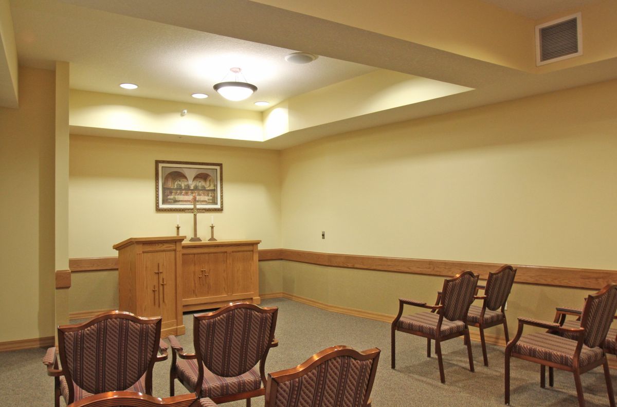 A small chapel with a podium and arranged seating.