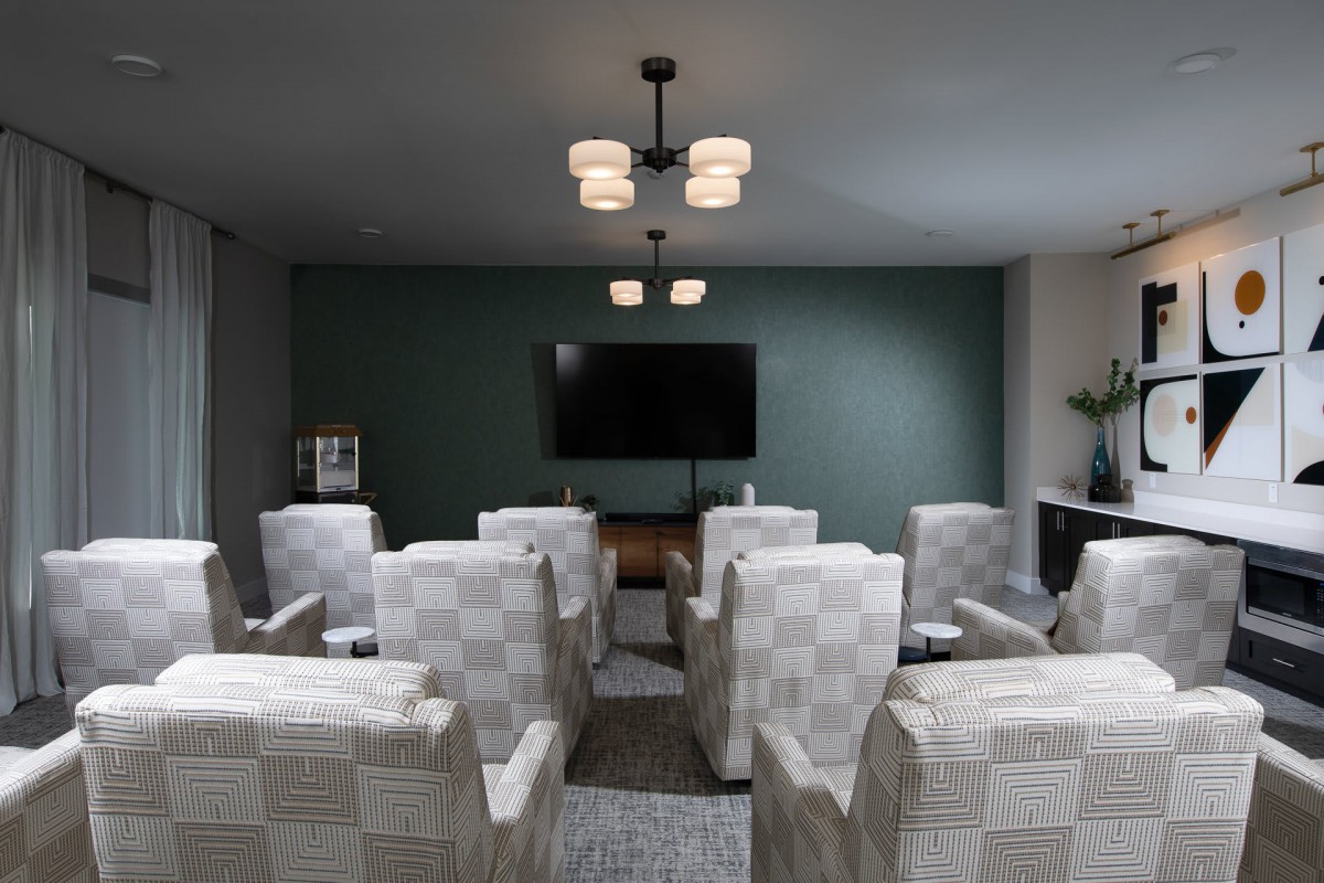 A cozy home theater setup with comfortable seating and ambient lighting.