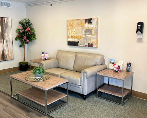 A cozy and modern living room setup featuring a comfortable sofa, stylish tables, and decorative elements.
