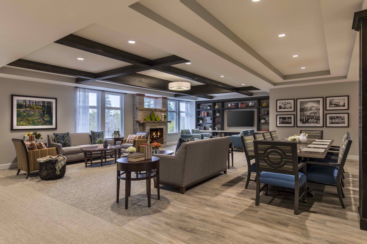 A modern living room with cozy seating and elegant decor.