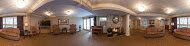 Spacious and modern living room with stylish furniture and wooden flooring.