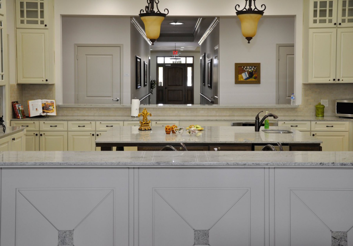 A modern kitchen with elegant lighting and a spacious countertop.