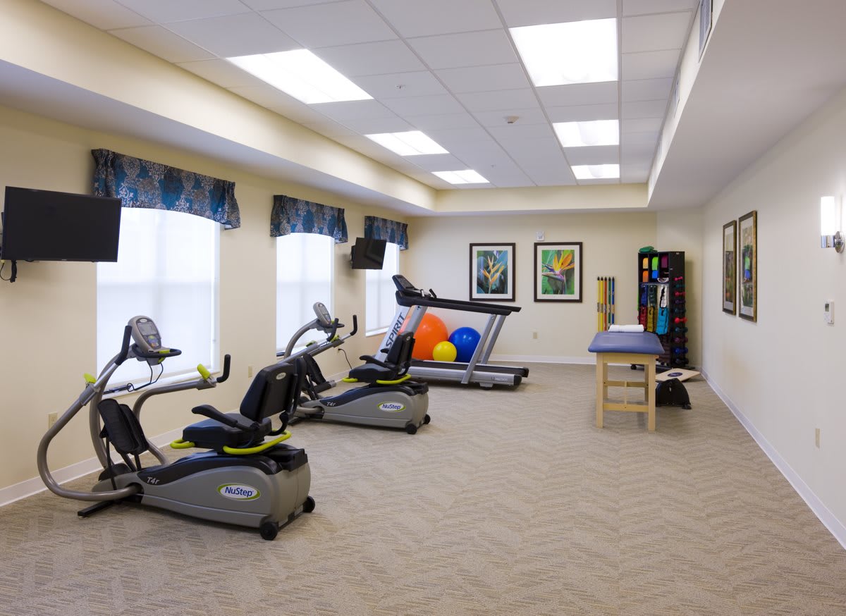 A well-equipped gym with exercise machines and rehabilitation tools.