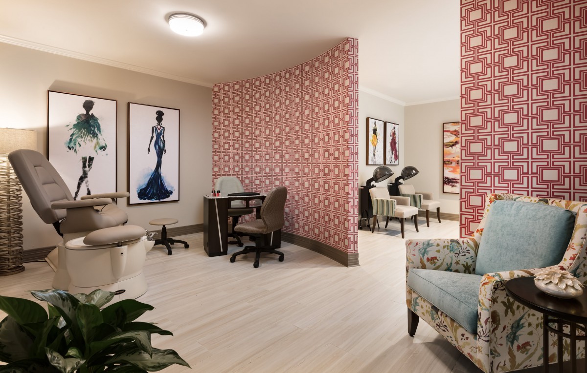 Modern salon interior with stylish decor and artwork.