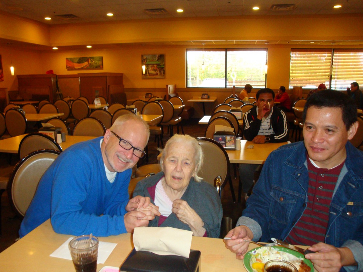 A group of people enjoying a meal together at a restaurant.