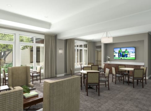 A modern living and dining area with contemporary furniture and a television.
