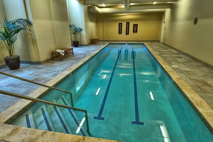An indoor swimming pool with lanes marked for laps.