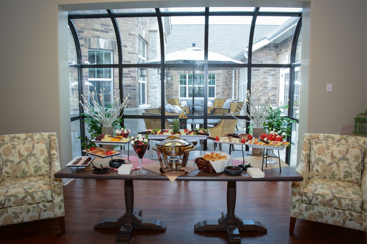 A beautifully arranged buffet table set up for brunch in a bright indoor space.