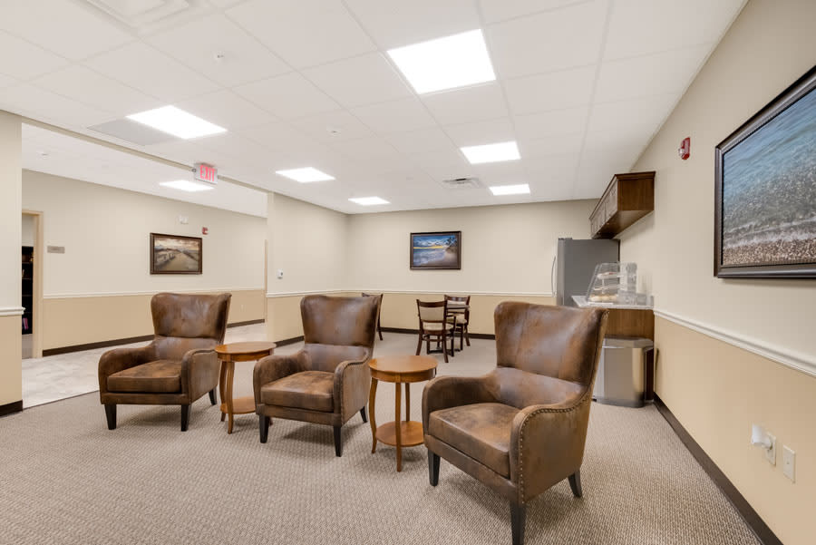 A well-lit lobby with comfortable seating and decor.