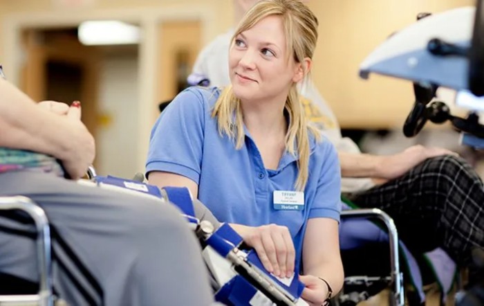 A nurse attending to a patient in a hospital setting.