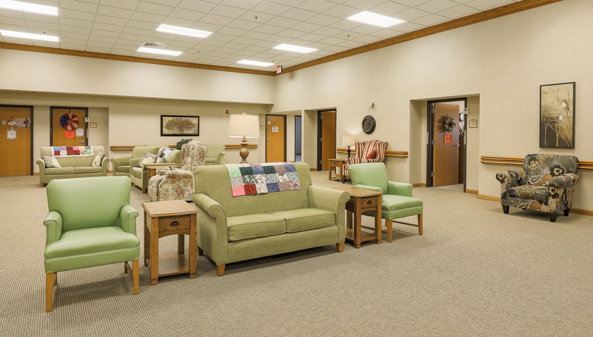 A spacious lobby area with comfortable seating and warm lighting.