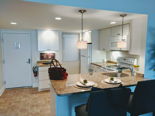 A modern kitchen featuring a well-designed island and contemporary lighting.
