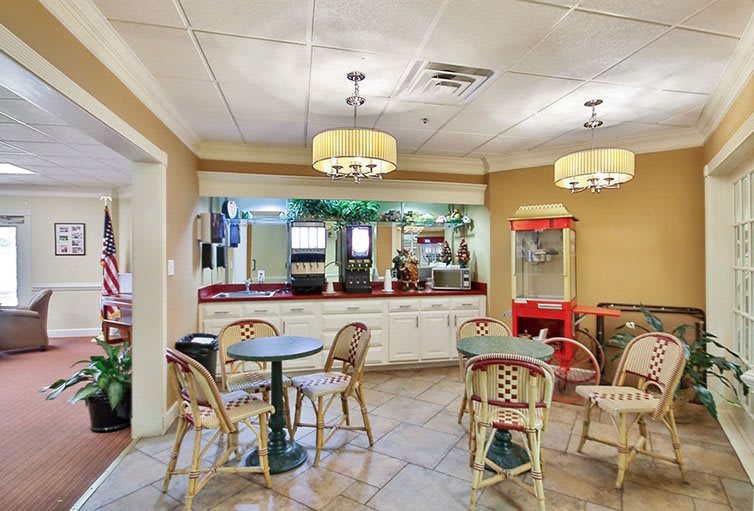An inviting indoor cafe with seating and a snack bar.