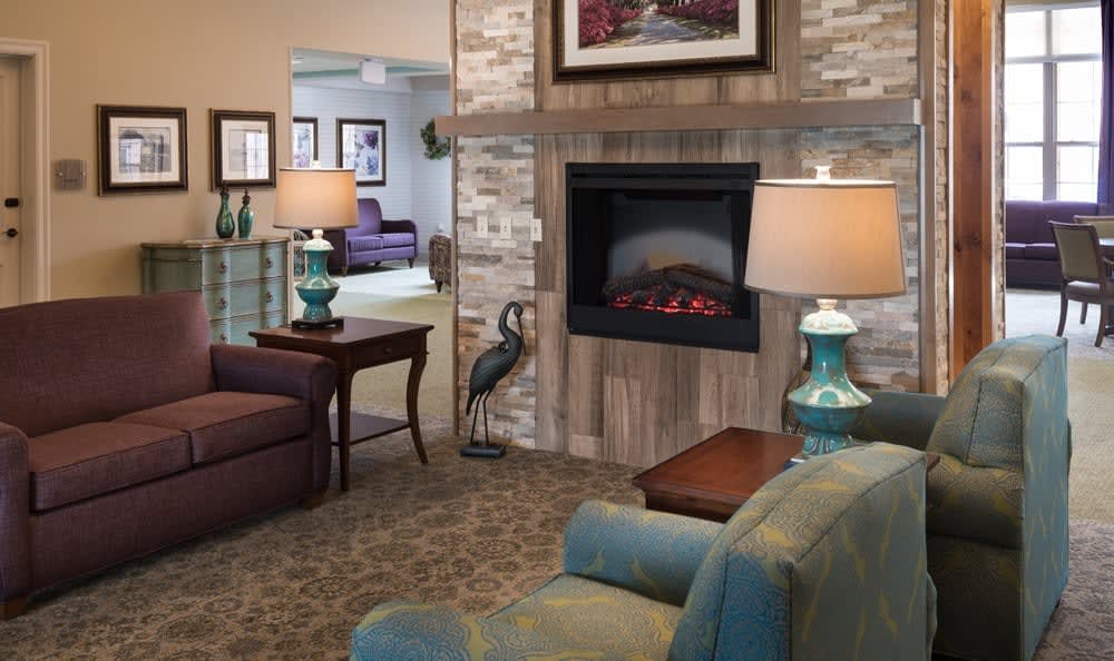Cozy living room with a fireplace and stylish decor.