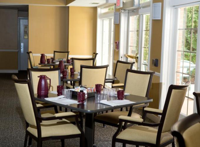 An indoor dining area with neatly arranged tables and chairs.