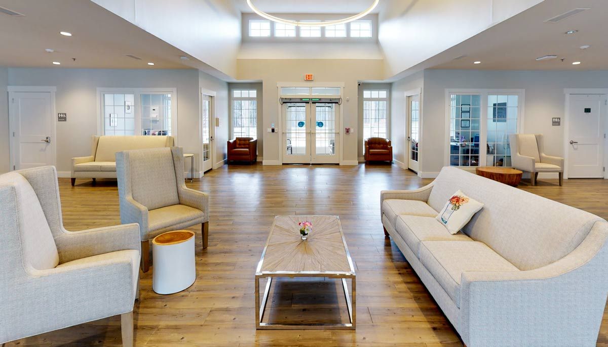 A modern and spacious lobby with comfortable seating and bright lighting.