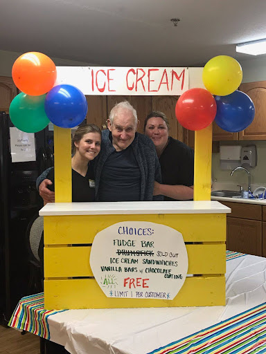 A cheerful ice cream stand with colorful balloons, bringing smiles to everyone!