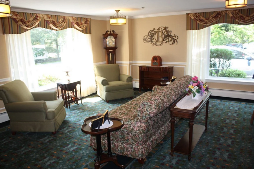 A traditional living room with elegant furniture and decor.