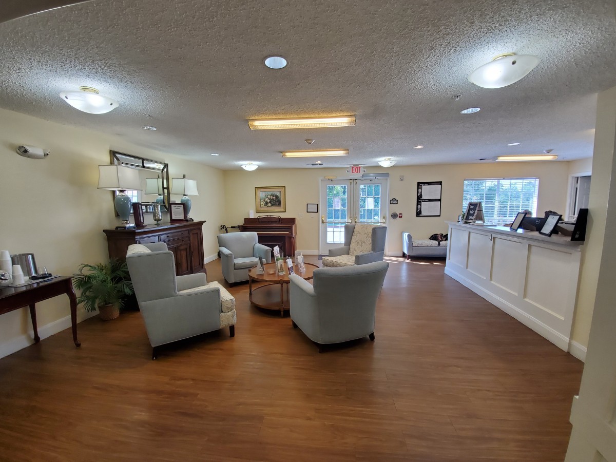 A cozy lobby with comfortable seating and a reception desk.