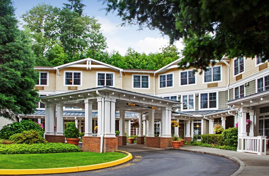 A well-maintained building with a welcoming entrance surrounded by greenery.