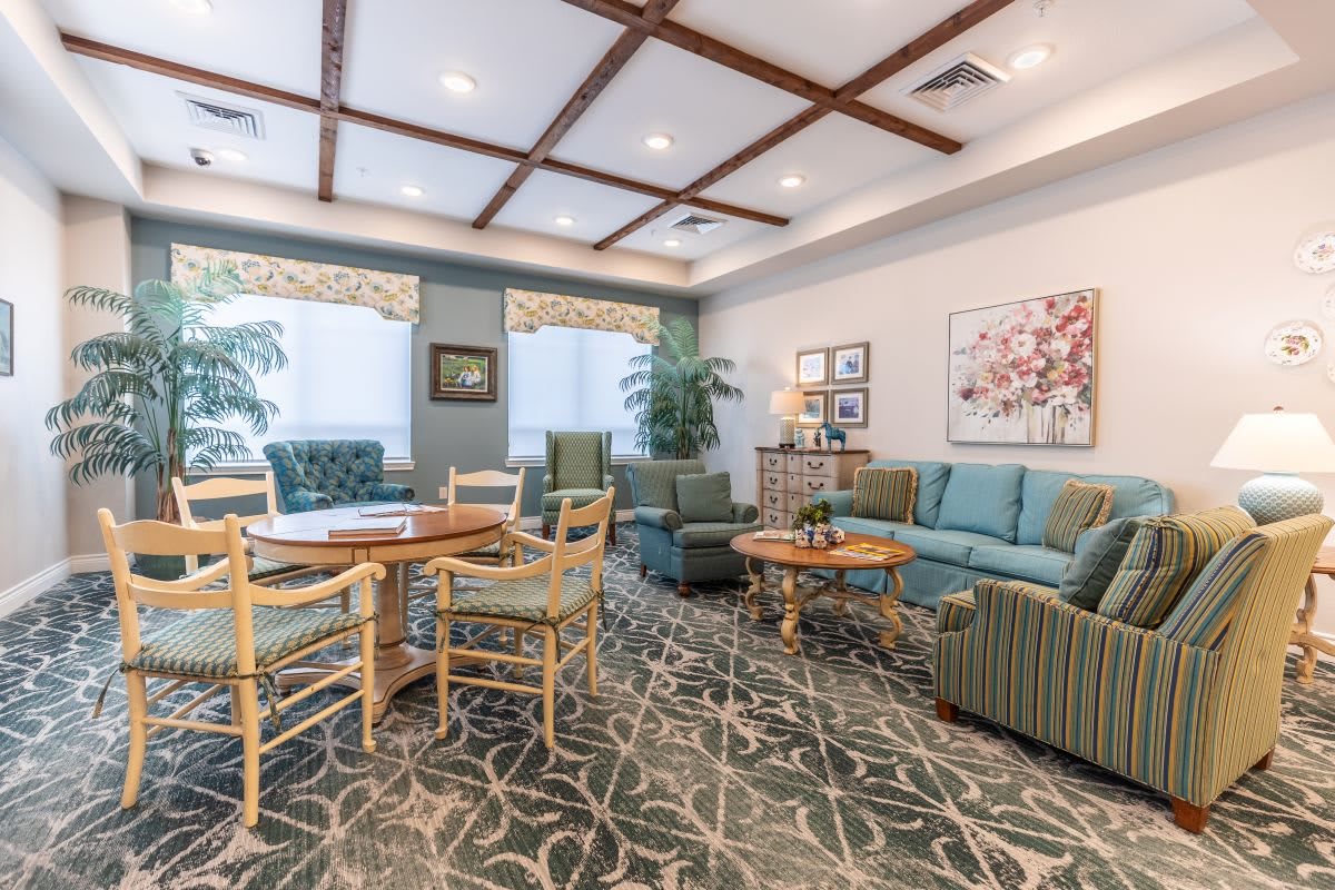A cozy living room with comfortable seating and elegant decor.