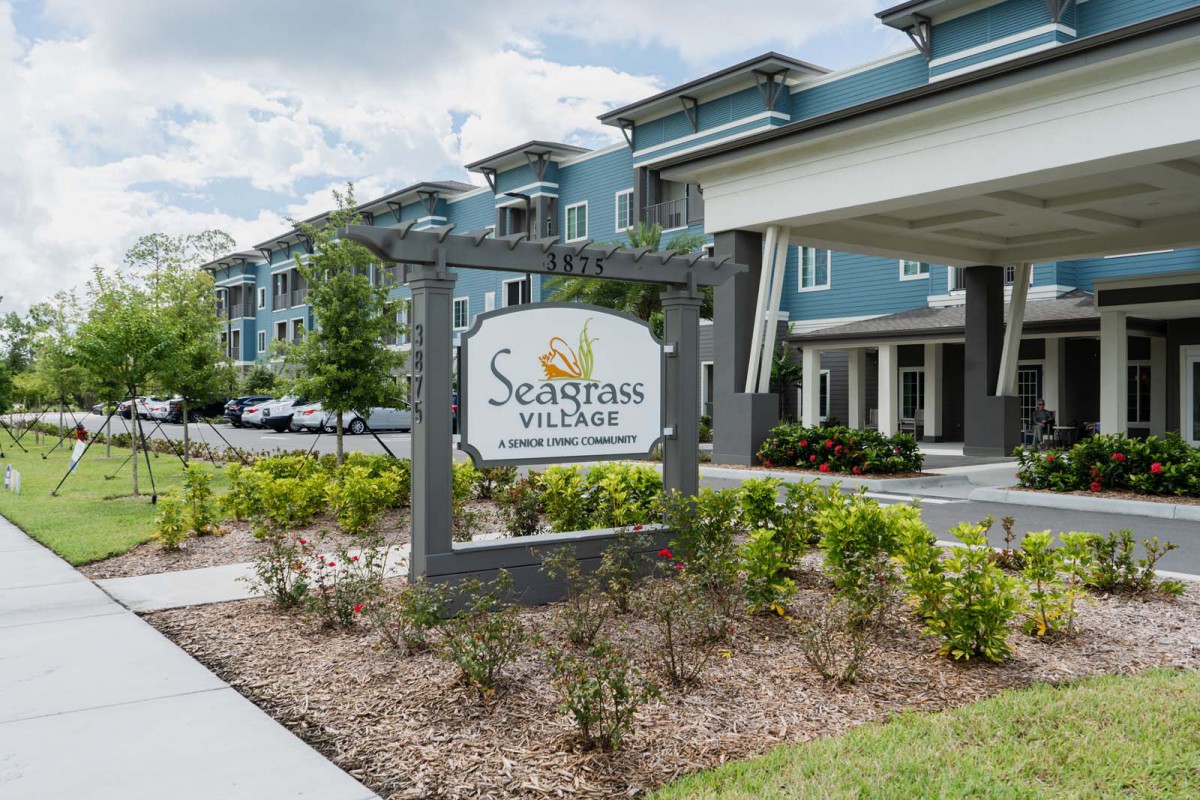 Entrance to Seagrass Village with landscaped surroundings.