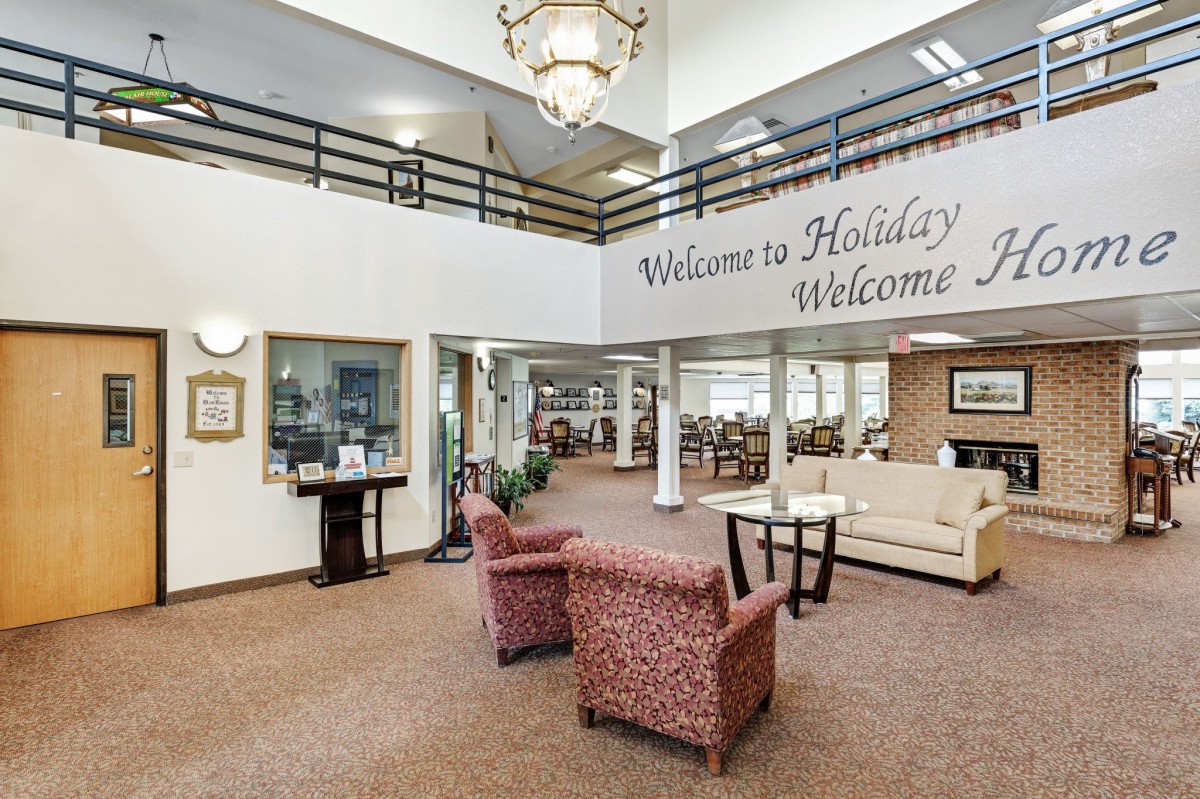 A welcoming lobby area with comfortable seating and a large chandelier.