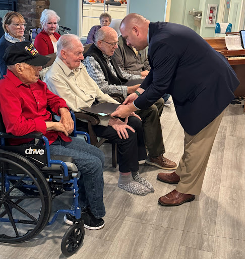 An engaging moment during a community event, highlighting interaction between participants and a speaker.