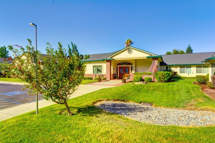 A suburban house with a well-maintained front yard and pathway.