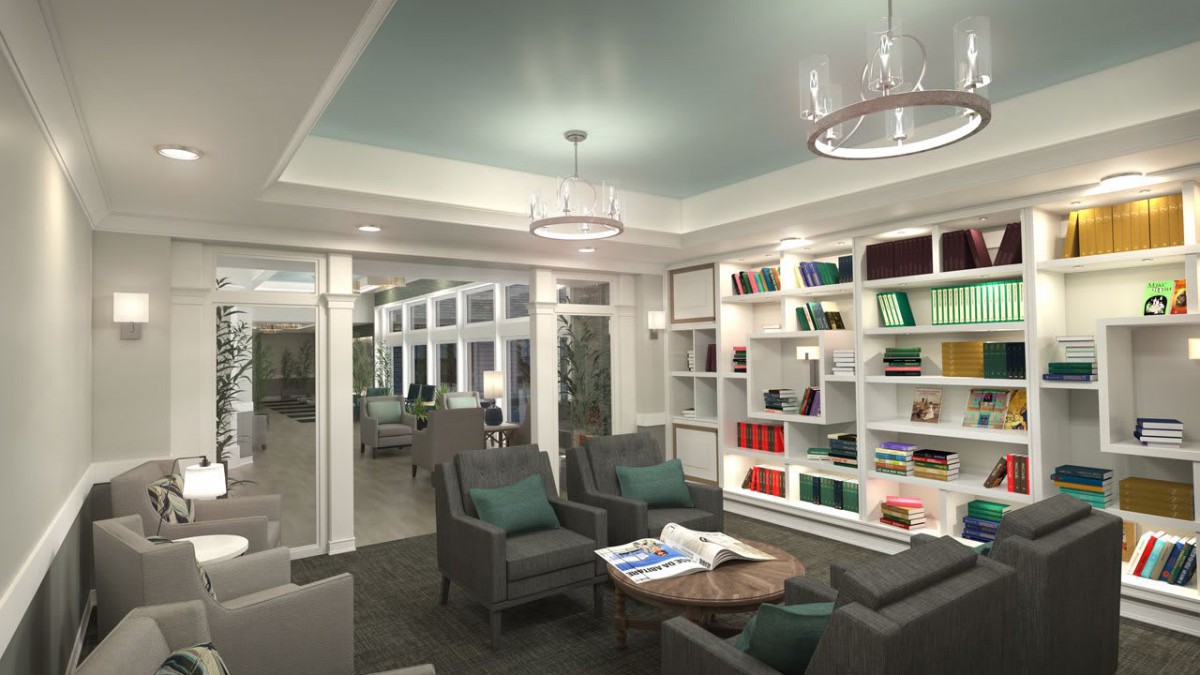 A modern library interior featuring comfortable seating and well-organized bookshelves.