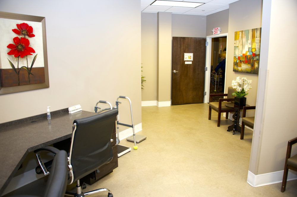 Modern office space with a waiting area and desk.