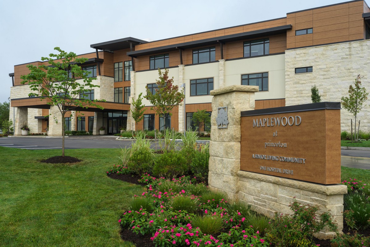 A modern healthcare facility with well-maintained landscaping and clear signage.