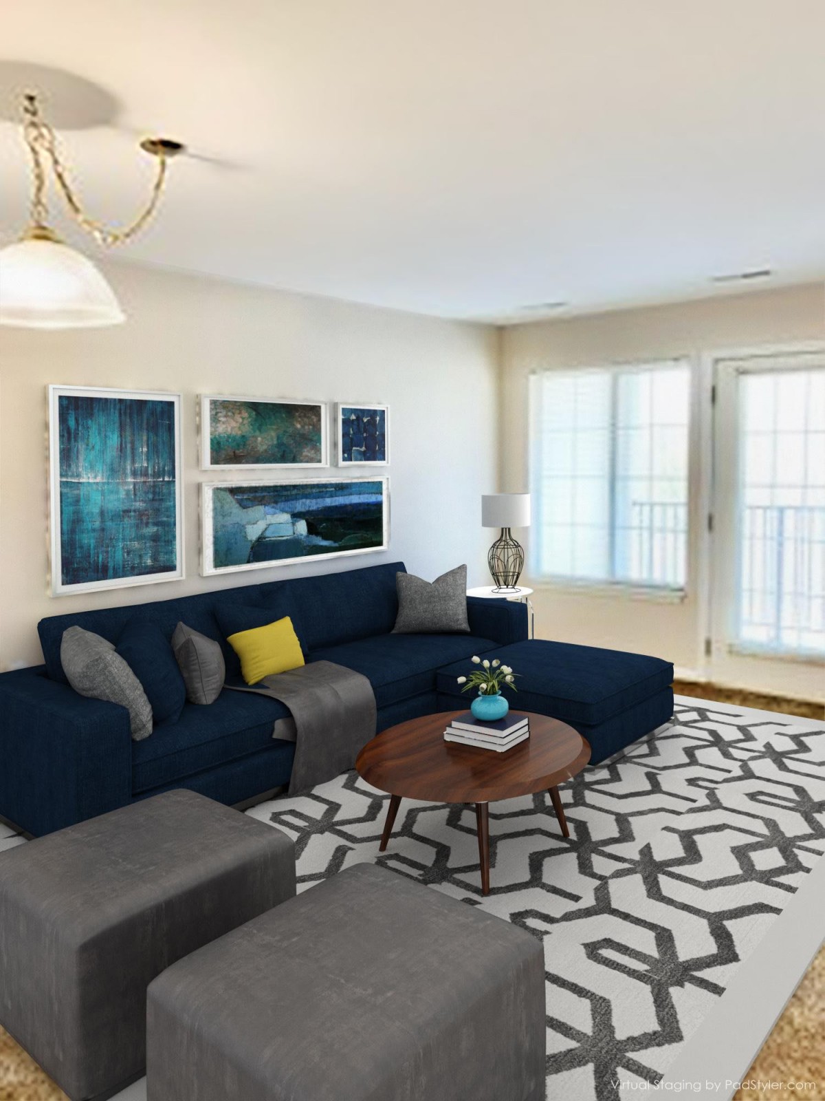 A modern living room with a navy sofa, abstract artwork, and geometric patterned rug.