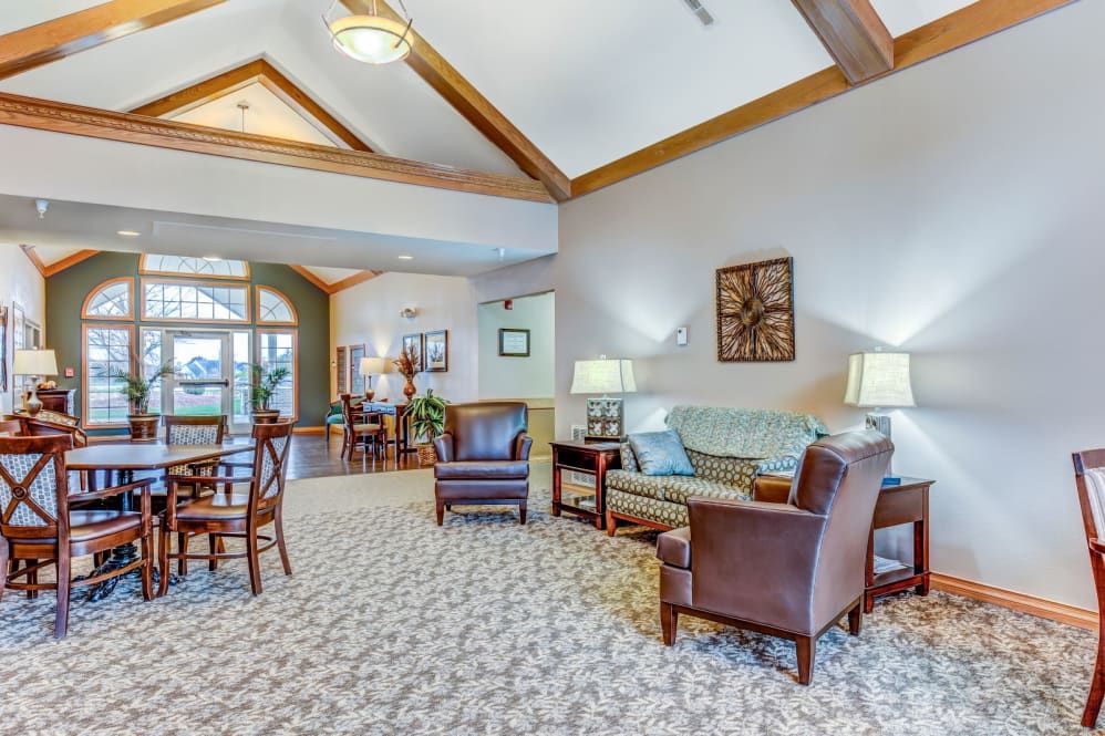 A cozy living room with comfortable seating and warm lighting.